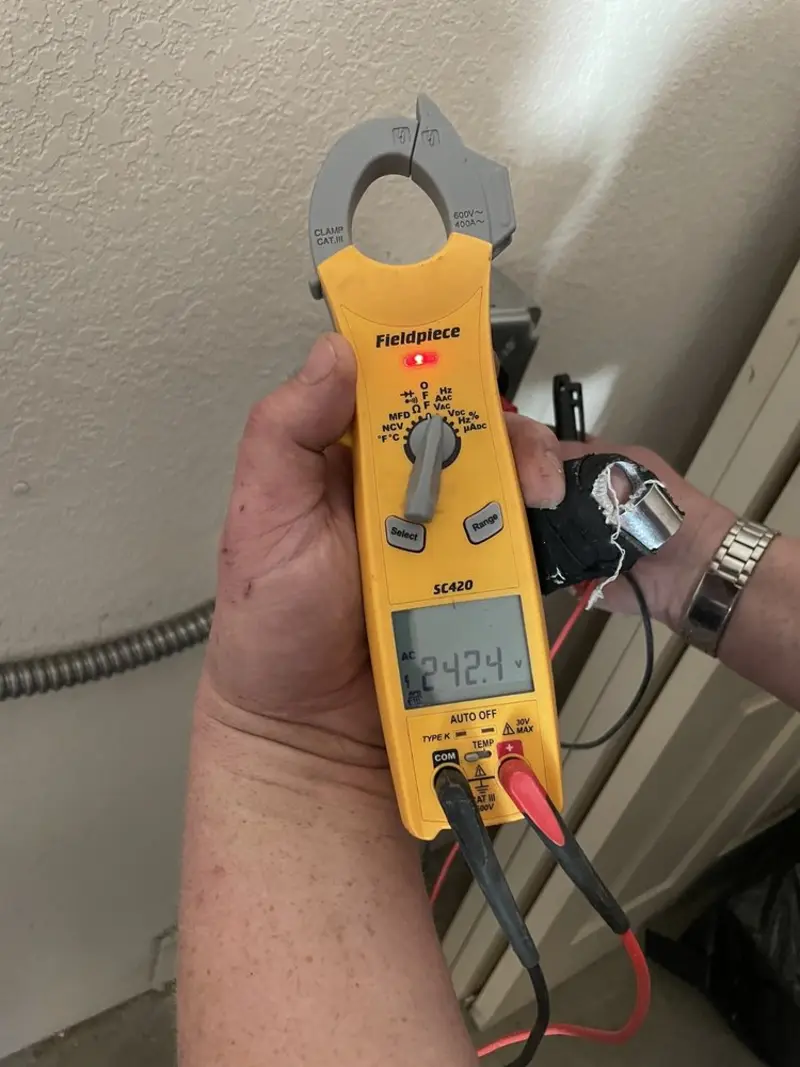 Voltage testing with clamp meter during Outlet Installation in Ware